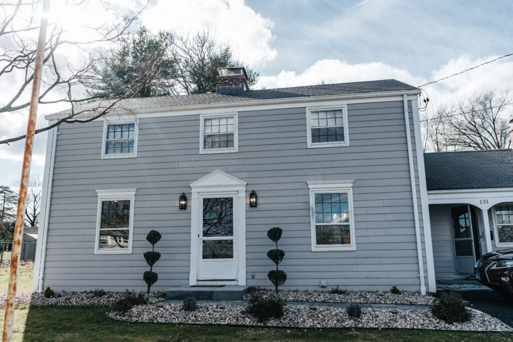Exterior house painting project by contractor in Newington, CT