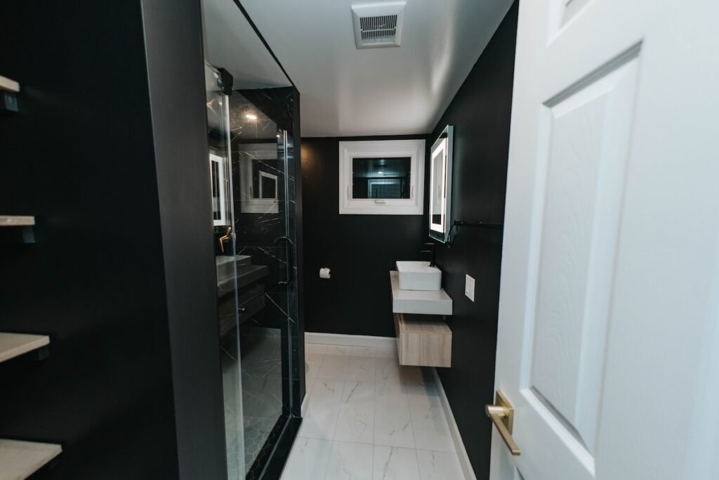 Bathroom remodeling project with modern shower and vanity renovation completed in Connecticut