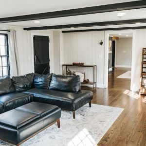 Interior carpentry finishing in open living room layout with trim and wood flooring in Newington Connecticut