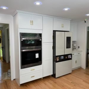 Kitchen remodeling project with double wall oven and custom cabinetry by contractor in Connecticut