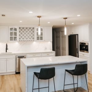White kitchen island remodeling project with modern pendant lighting in Connecticut