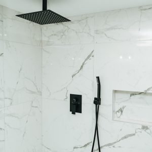 Walk in shower bathroom remodeling project with marble tile walls in Connecticut